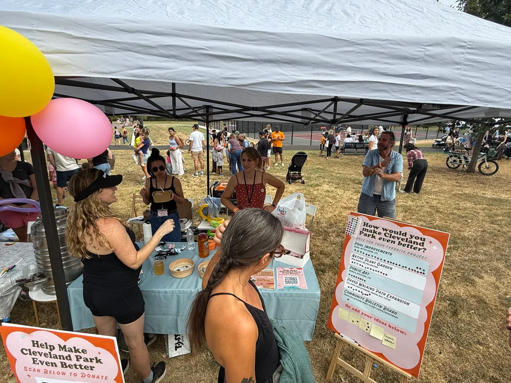 Neighbors sharing ideas at the Friends of Cleveland Park tent.